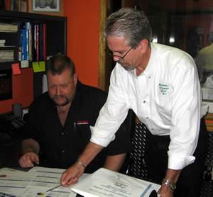 Scott Wheeler (right) advises a client